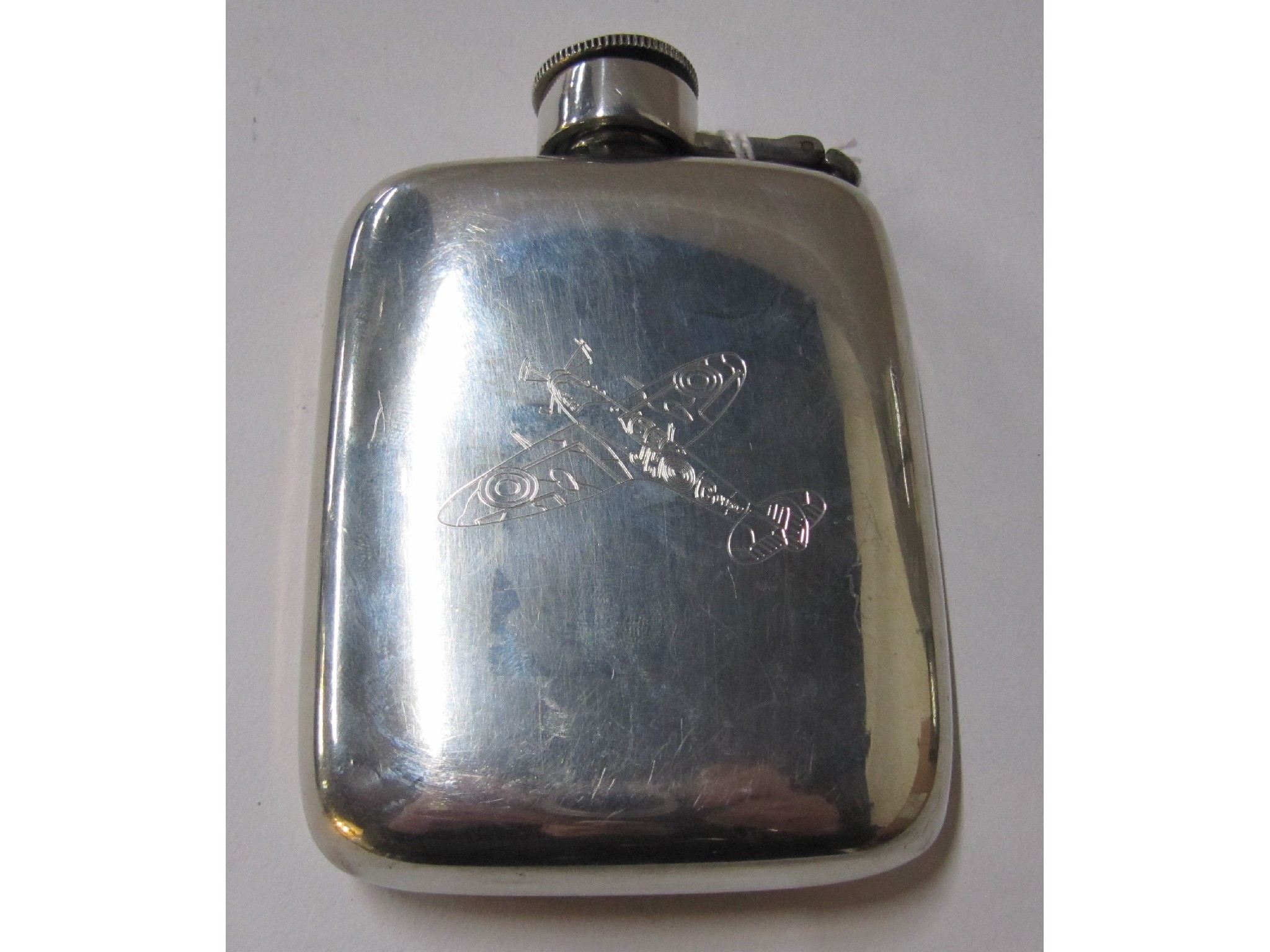 Appraisal: A white metal spirit flask engraved with an image of