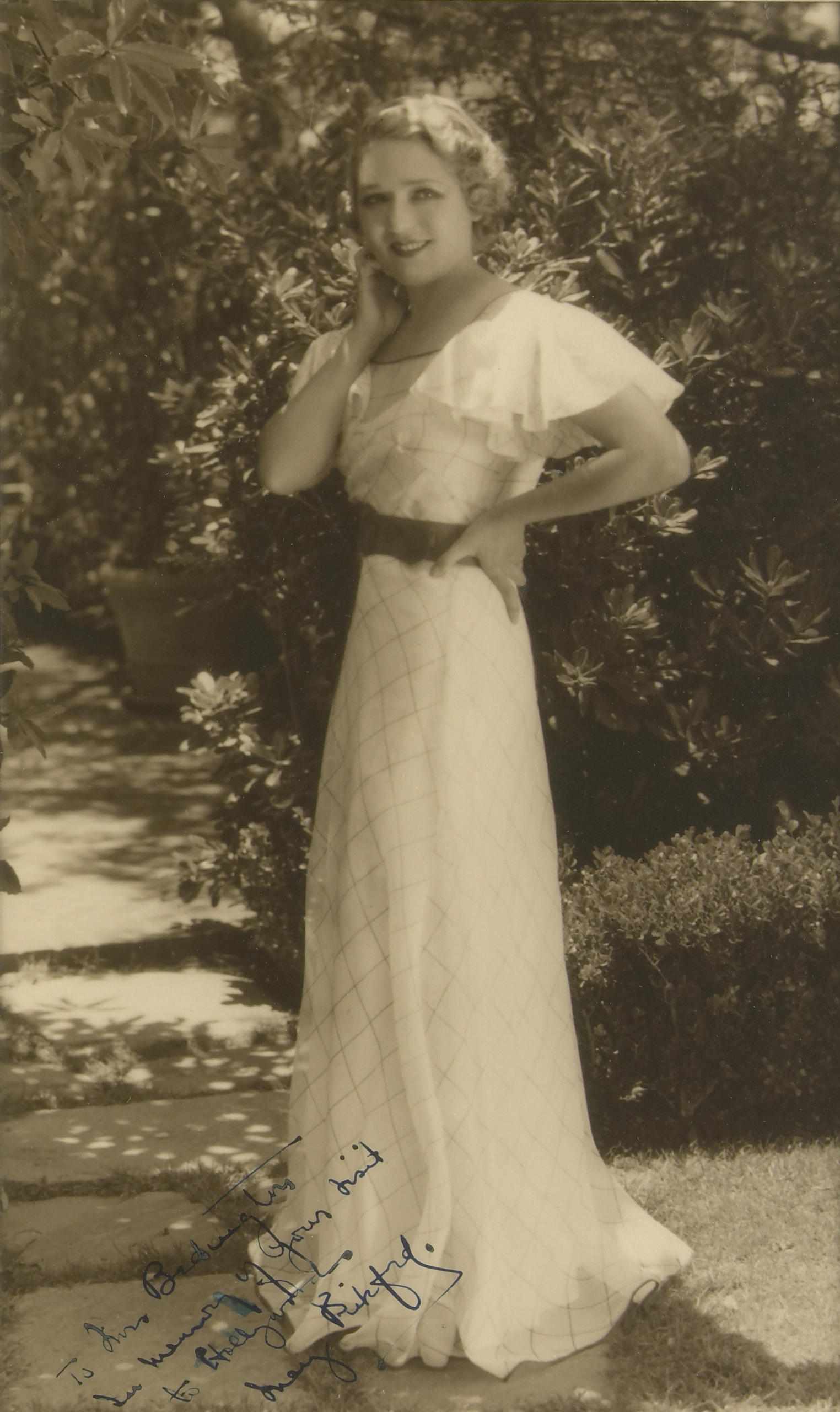 Appraisal: Mary Pickford signed photograph A vintage sepia tone standing portrait