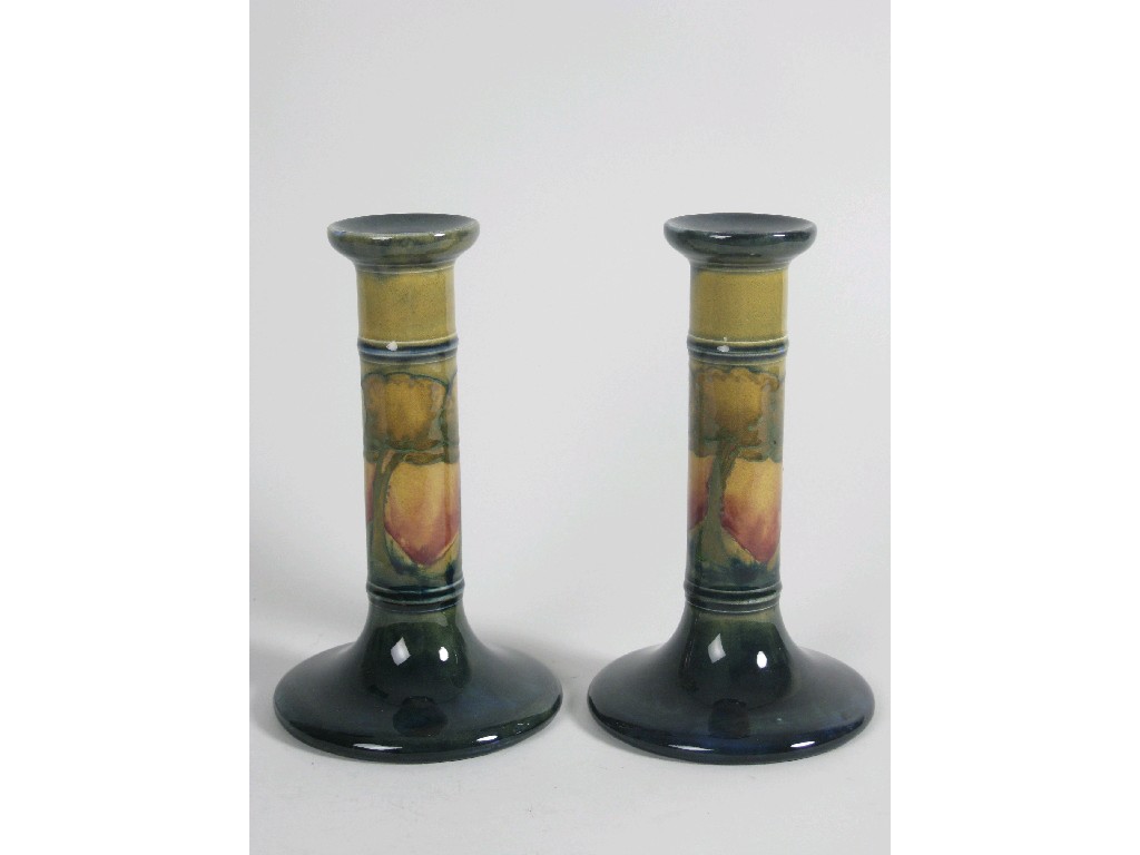 Appraisal: A rare pair of Moorcroft Pillar Candlesticks Eventide design trees