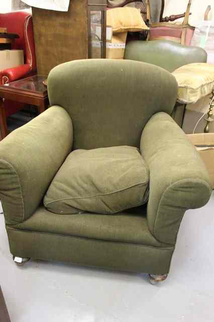 Appraisal: A GREEN UPHOLSTERED EARLY TH CENTURY DEEP ARM CHAIR wide