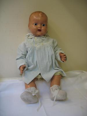 Appraisal: A composition baby doll with painted face blue glass sleeping