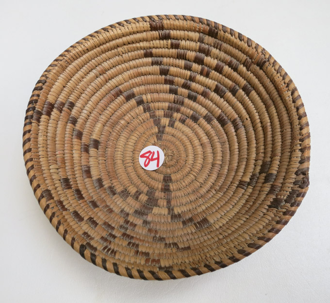 Appraisal: COILED NATIVE AMERICAN TRIBAL BASKET of two-color geometric design Diameter