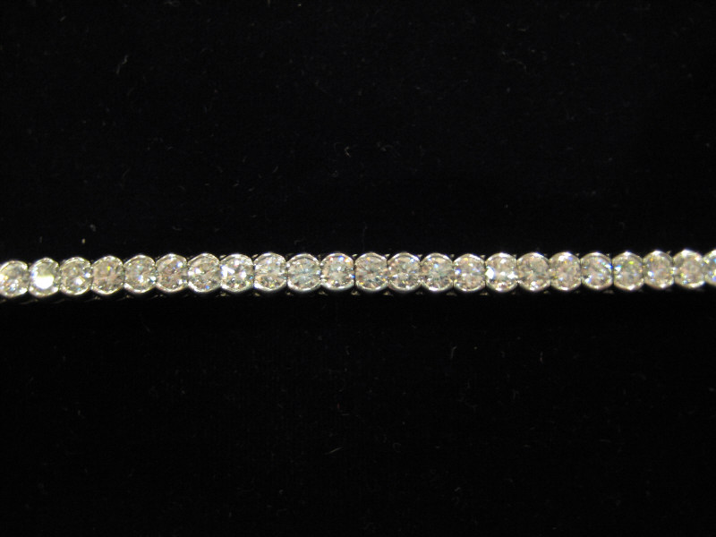 Appraisal: DIAMOND LINE BRACELET Platinum bracelet with forty-five bezel set round