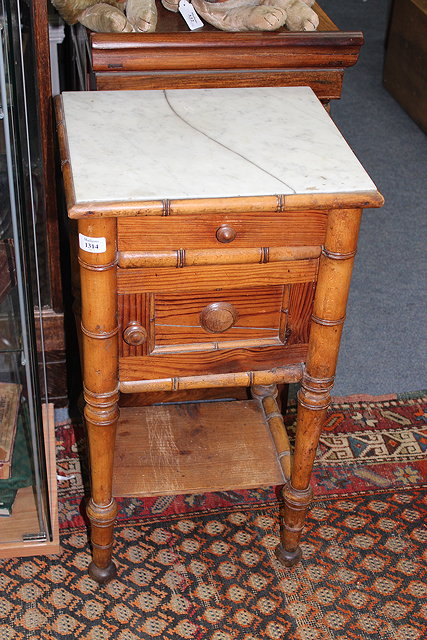 Appraisal: AN EDWARDIAN SIMULATED BAMBOO AND PINE MARBLE TOP POT CUPBOARD