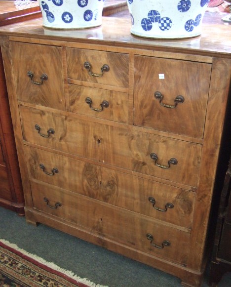 Appraisal: A th century walnut chest of four drawers over three