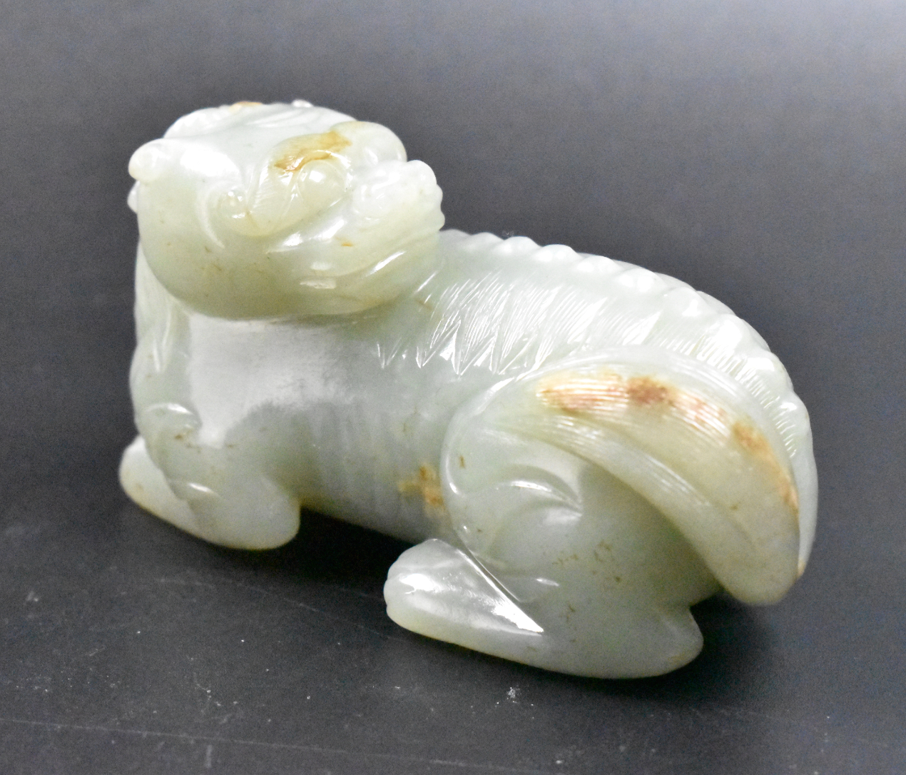 Appraisal: A Chinese jade carved beast dating from the Qing dynasty