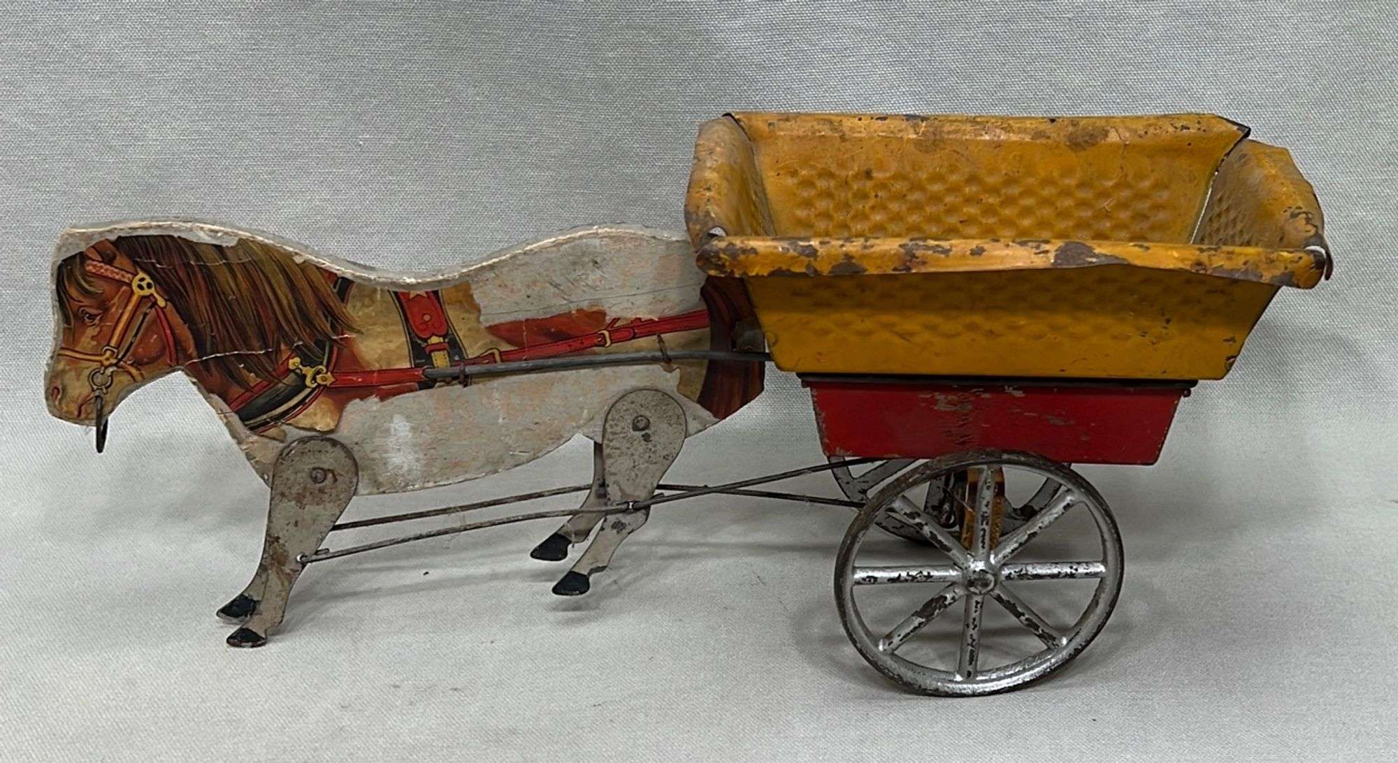 Appraisal: Antique tin and lithograph horse-drawn cart toy