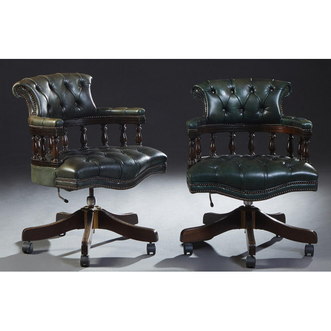 Appraisal: Pair of English Green Leather Swivel Barrel Back Armchairs th