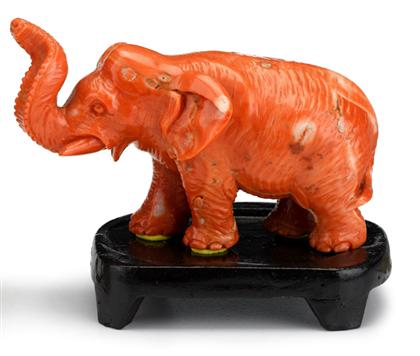 Appraisal: Chinese carved coral elephant Naturalistic model over wood stand