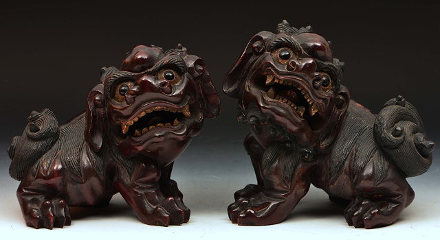 Appraisal: Pair of Chinese carved and lacquered wood temple dogsstanding cm