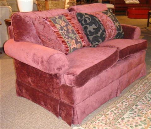 Appraisal: CRANBERRY VELVET UPHOLSTERED LOVE SEAT WITH TWO COORDINATING PILLOWS h