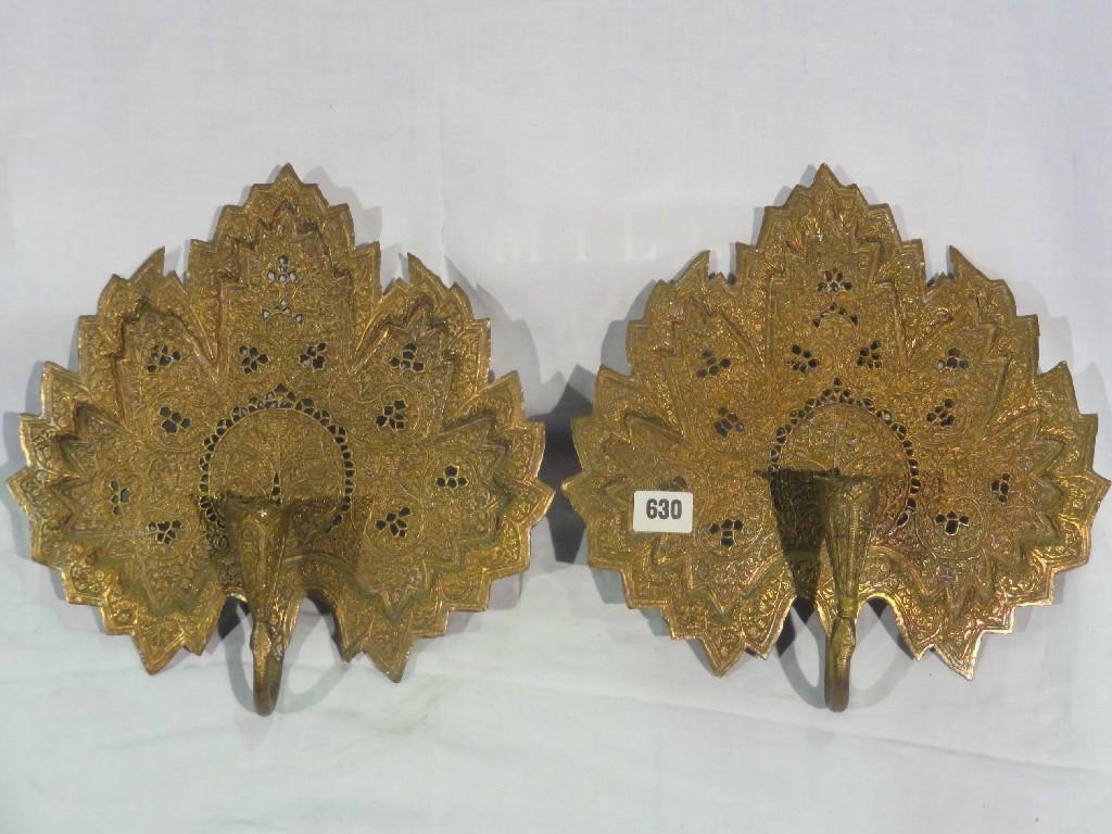 Appraisal: A pair of Indian bronze effect filigree wall candle sconces