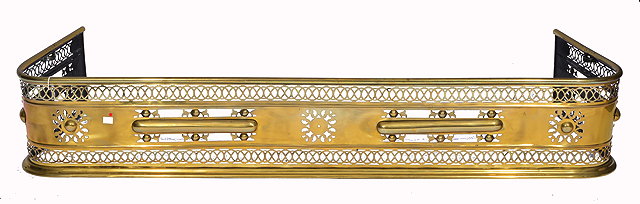 Appraisal: A TH CENTURY LONG BRASS FIRE FENDER with pierced scrolling