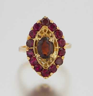 Appraisal: An k Gold and Garnet Ring k yellow gold ring