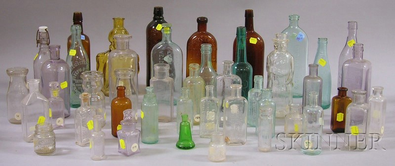 Appraisal: Approximately Seventy Colored and Colorless Glass Bottles molded with labeling