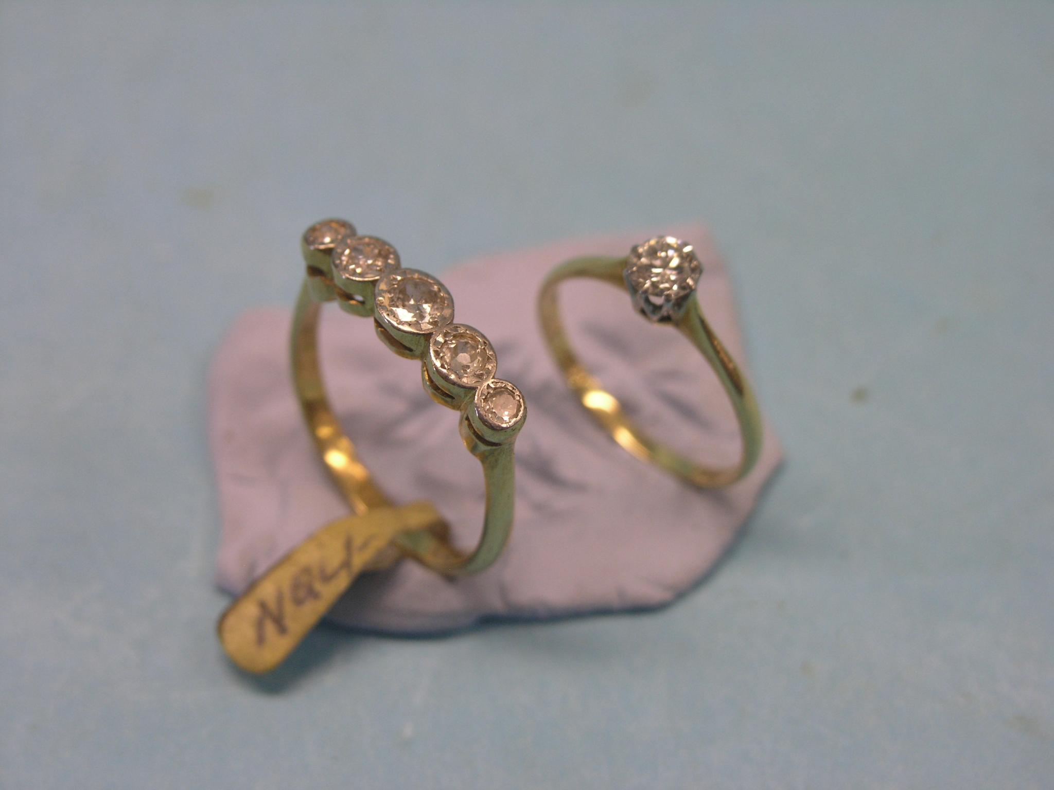 Appraisal: Two ct gold and diamond rings one five-stone half-hoop the