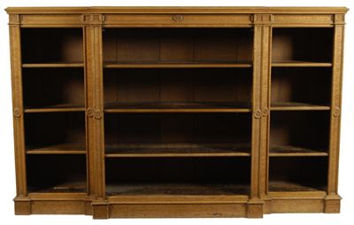 Appraisal: A pair of th century bird's eye maple breakfront bookcases