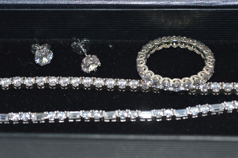 Appraisal: A CUBIC ZIRCONIA JEWELLERY SUITE INCLUDING TWO LINE BRACELETS STUD