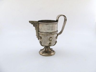 Appraisal: A continental silver ewer of circular form scroll handle with