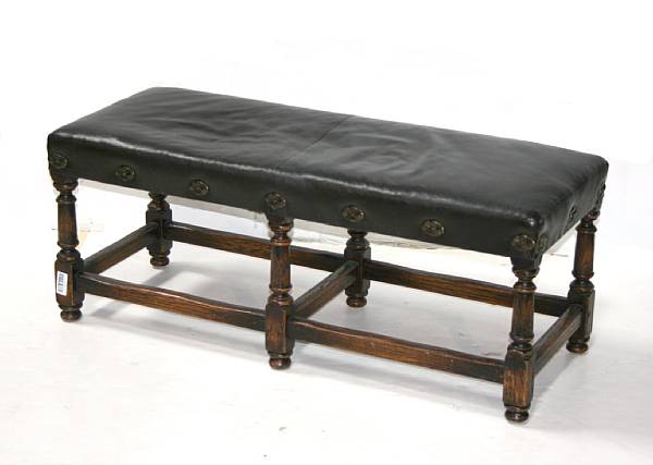 Appraisal: A Baroque style walnut and leather upholstered bench height in