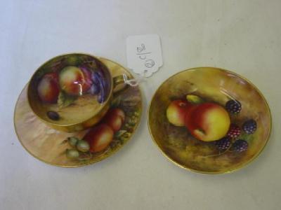 Appraisal: A ROYAL WORCESTER PORCELAIN CUP AND SAUCER painted with fruit