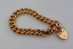 Appraisal: ct rose gold chased curb bracelet with ct padlock approx