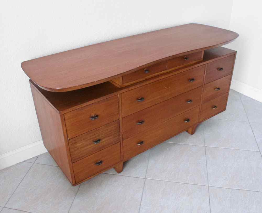 Appraisal: MID CENTURY TEAK SIDEBOARD DRESSER BUFFET The oval top floats