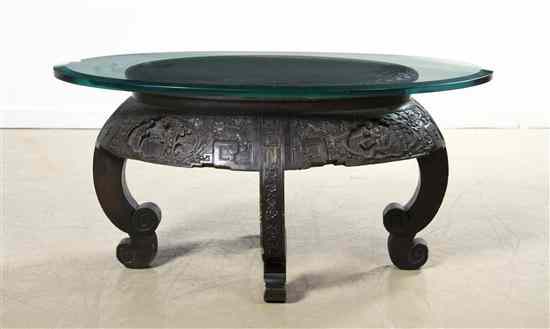 Appraisal: A Chinese Hardwood Table of oval form having a carved