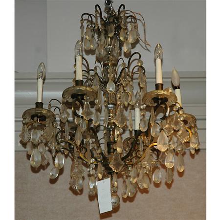 Appraisal: Louis XV Style Gilt-Metal and Cut Glass Eight-Light Chandelier Estimate