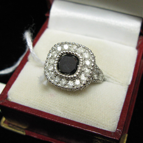 Appraisal: BLACK DIAMOND COLORLESS DIAMOND AND FOURTEEN KARAT WHITE GOLD RING