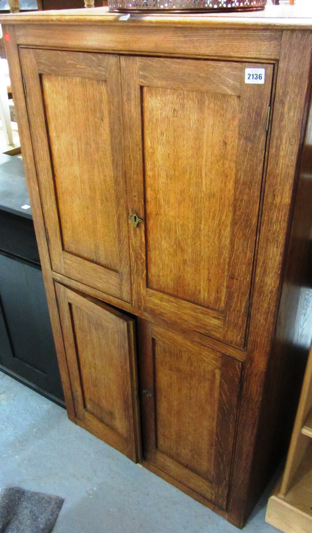 Appraisal: A th century oak floor standing cupboard with pairs of