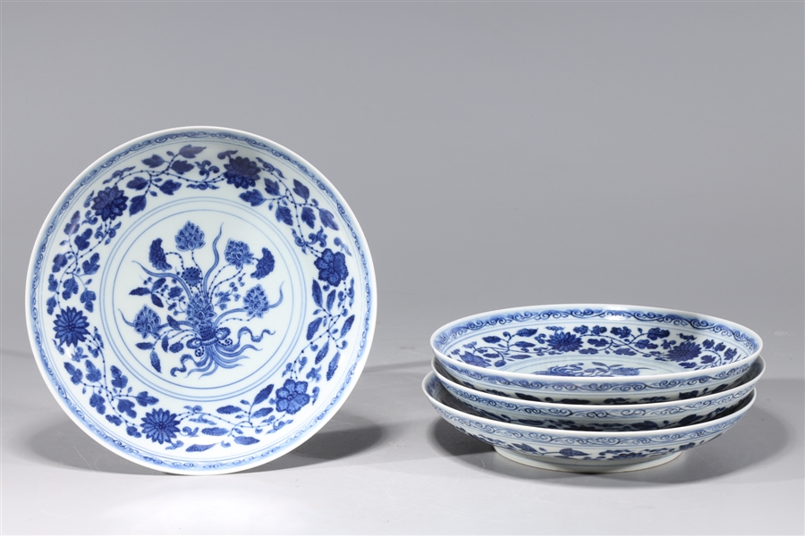 Appraisal: Four Chinese blue and white porcelain dishes with floral designs