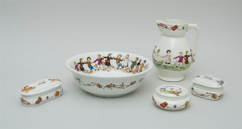 Appraisal: FRENCH TRANSFER-DECORATED FAIENCE CHILD'S WASH SET Two with underglaze black