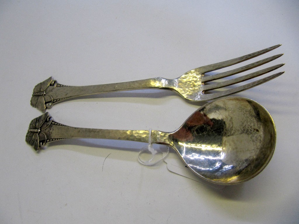 Appraisal: A Danish hammered silver fork and spoon with butterfly finials