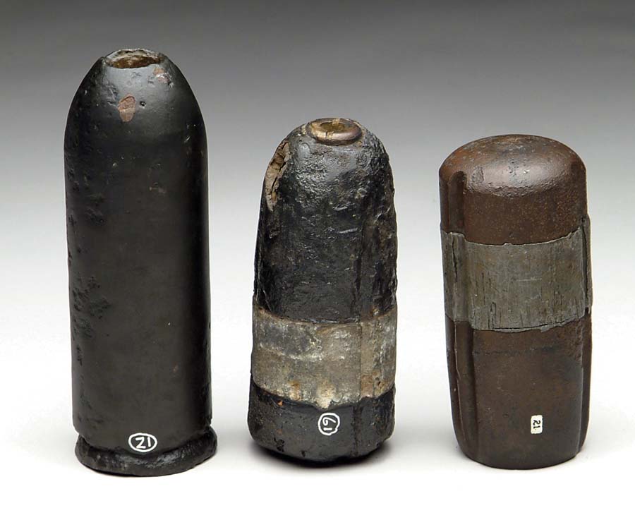 Appraisal: LOT OF THREE FIELD ARTILLERY PROJECTILES Excavated US -pounder Parrot