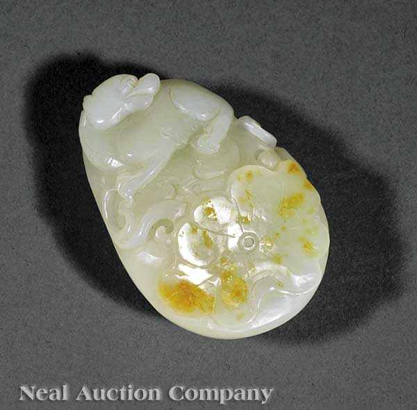 Appraisal: A Chinese White and Russet Jade Pebble Carving tear-shaped pebble