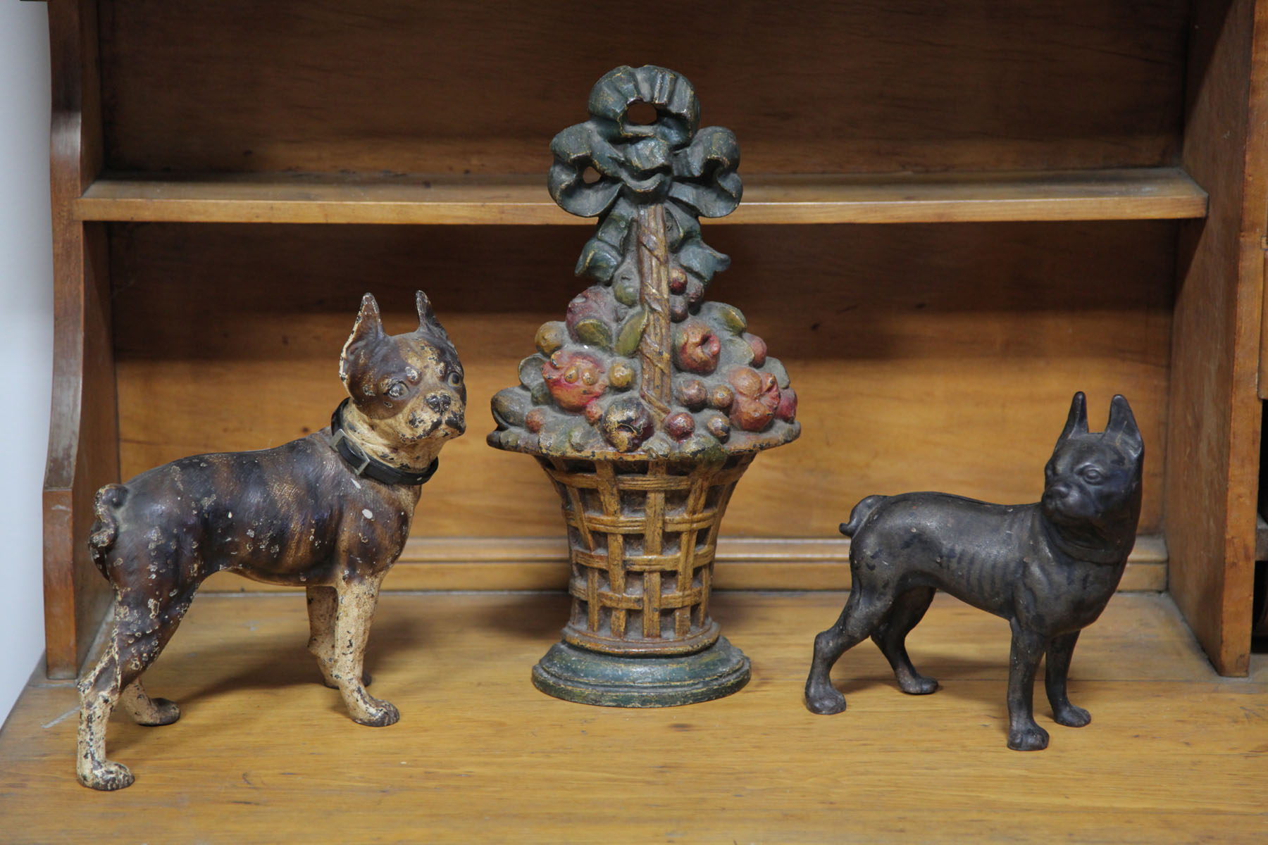 Appraisal: THREE DOOR STOPS American early th century Two Boston Terriers