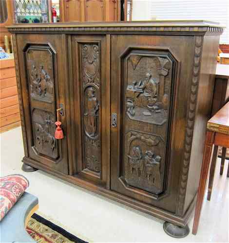 Appraisal: PICTORIAL CARVED OAK CABINET BOOKCASE German early th century the