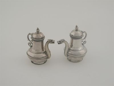 Appraisal: A pair of th century continental altar cruet vessels of