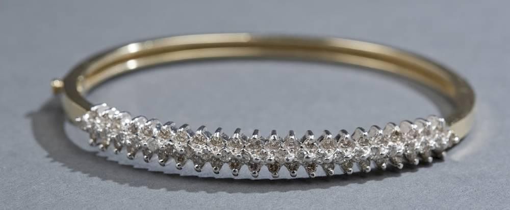 Appraisal: Diamond and kt gold bangle A ct diamond and kt