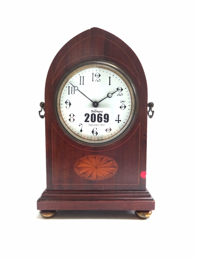 Appraisal: An Edwardian mahogany and inlaid mantel clock the arched case