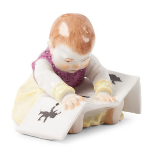 Appraisal: A Meissen Porcelain Baby Reading a Book by Konrad Hentschel