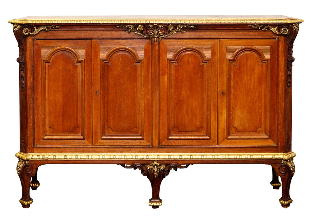 Appraisal: CONTINENTAL CLASSICAL-REVIVAL GILDED AND CARVED STAINED OAK SIDEBOARD LATE TH