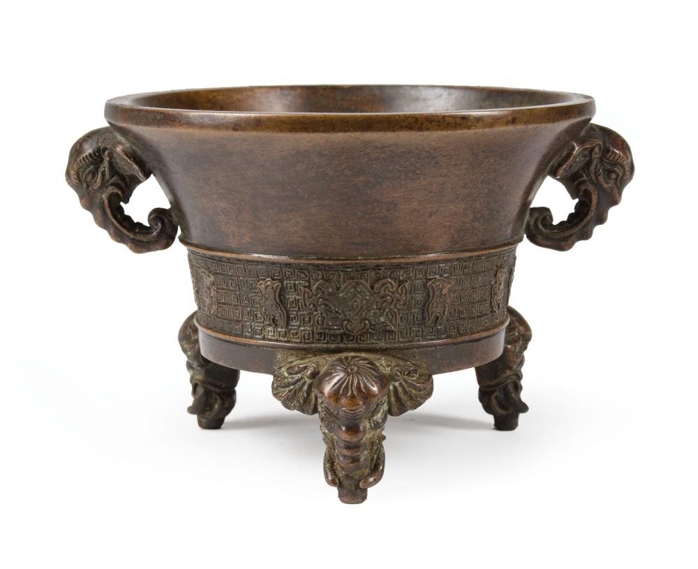 Appraisal: Chinese Bronze Tripod Censer elephant mask handles archaistic band three