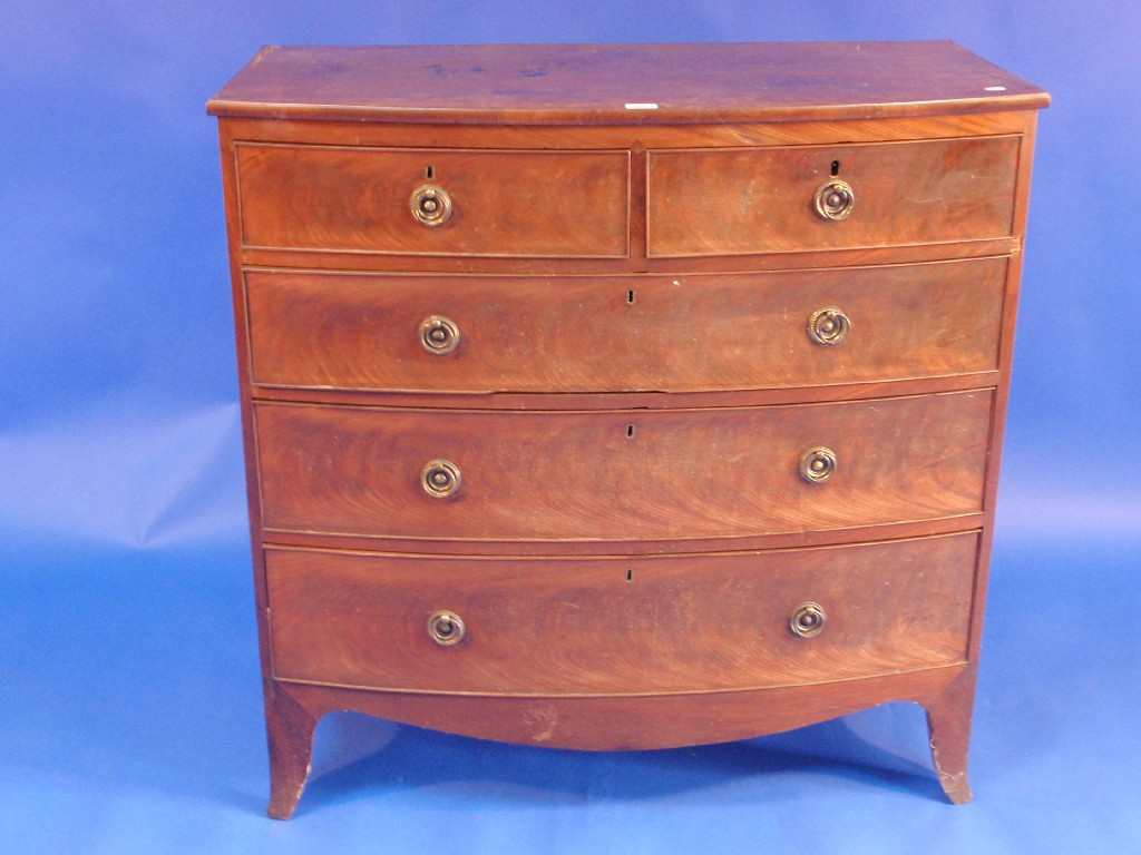 Appraisal: A Regency flamed mahogany bow front chest of two short