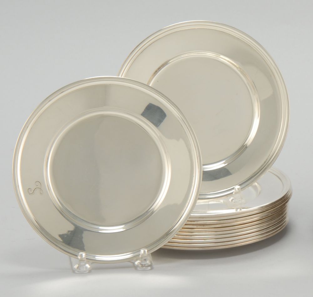 Appraisal: TWELVE TIFFANY STERLING SILVER BREAD AND BUTTER PLATES In circular