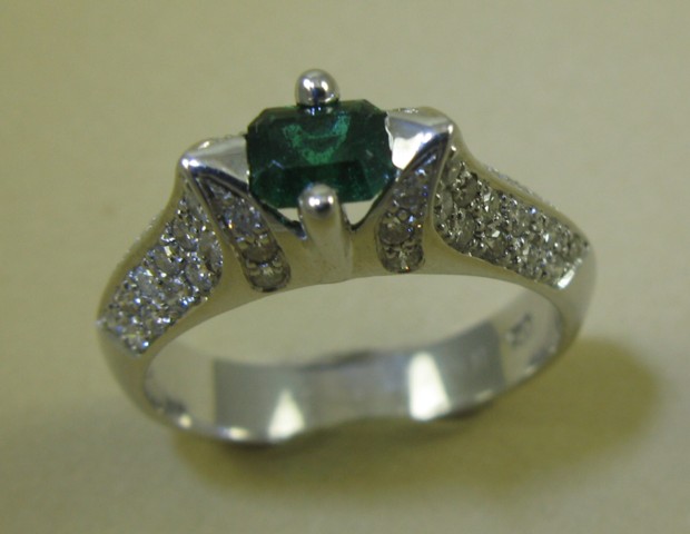 Appraisal: EMERALD AND DIAMOND RING k white gold and centering an