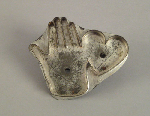 Appraisal: Tinned heart and hand cookie cutter th c x