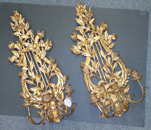 Appraisal: A pair of Italian Neoclassical style giltwood three light wall