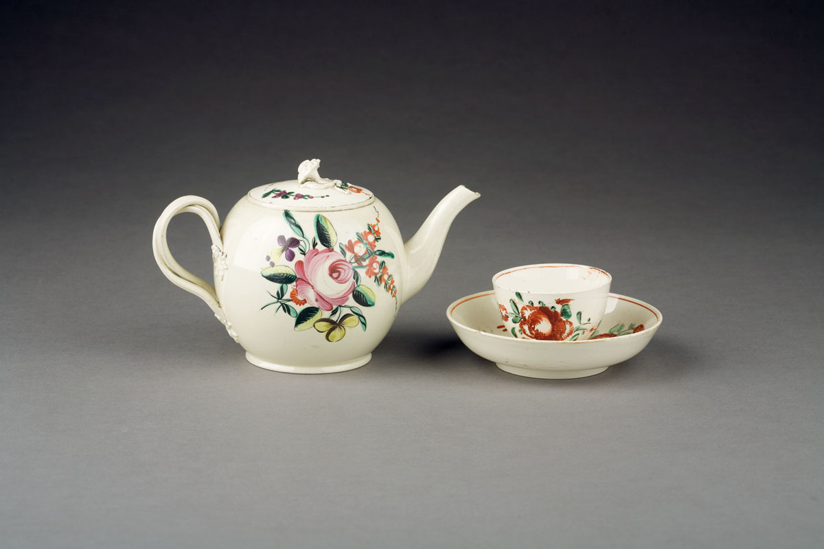 Appraisal: ENGLISH CREAMWARE ENAMELED TEAPOT AND COVER AND A TEABOWL AND